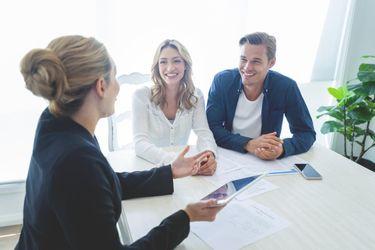 A realtor explaining the prequalifying process to a couple